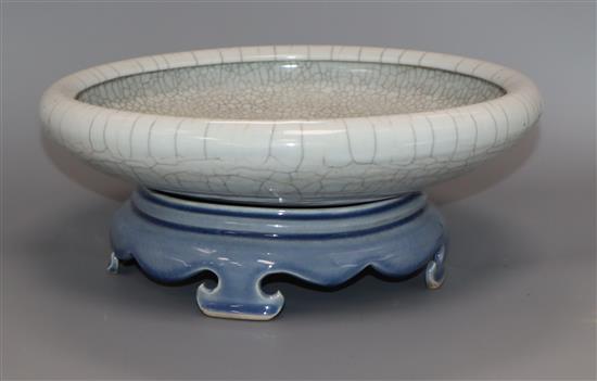 A Chinese crackle glaze dish, late 19th century, later stand diameter 29cm